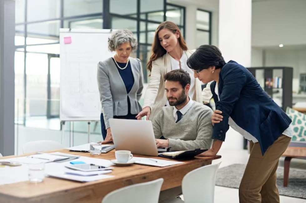 a group of businesspeople discussing a project during a meeting in the boardroom