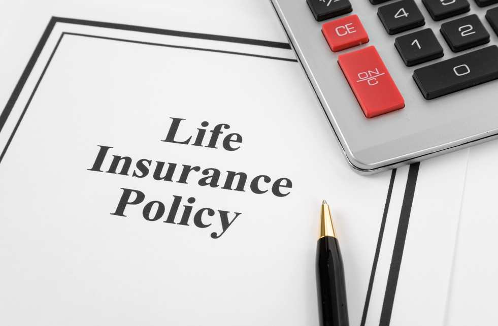 calculator, pen and life insurance policy depicted on the sheet