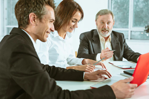 An image featuring a diverse group of people engaged in a discussion about approval