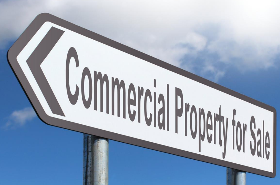 a sign that says Commercial Property for Sale